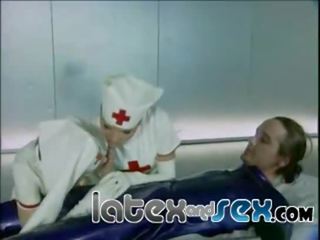 Latex nurses treat a rubber gas mask bloke